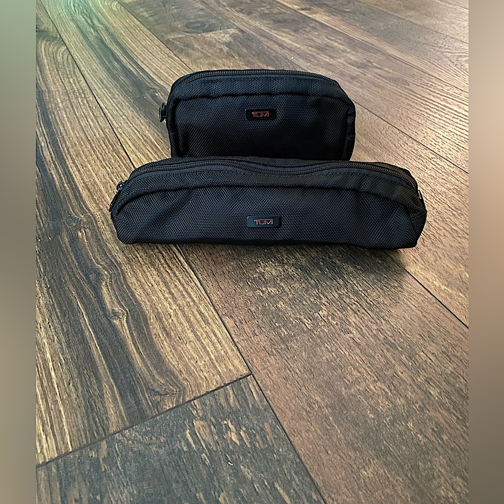 TUMI cord carrying case and a small travel bag